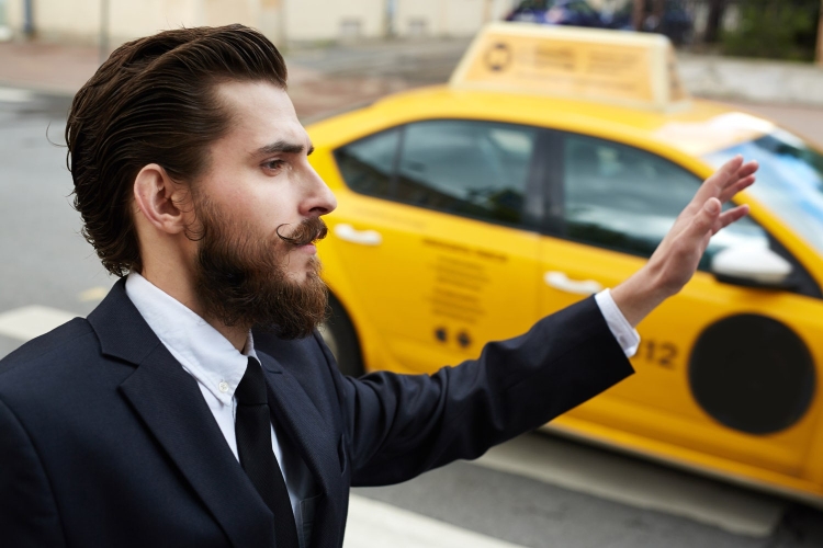 Businessman catching Taxi in Storm